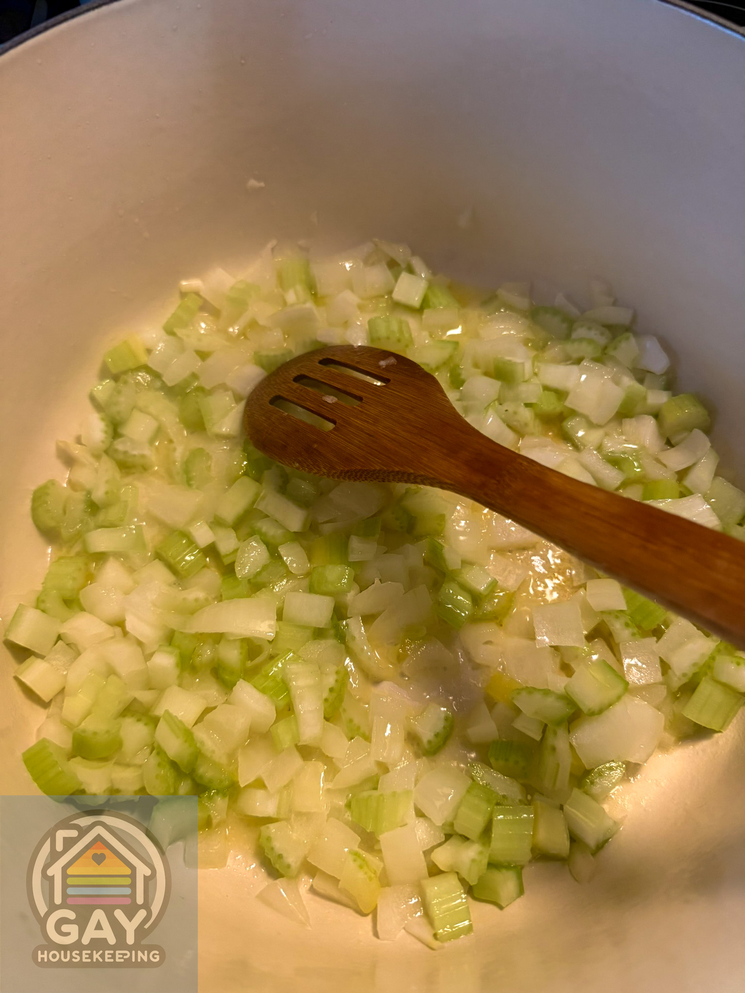 Diced onion and celery softening in melted butter in the Dutch oven.