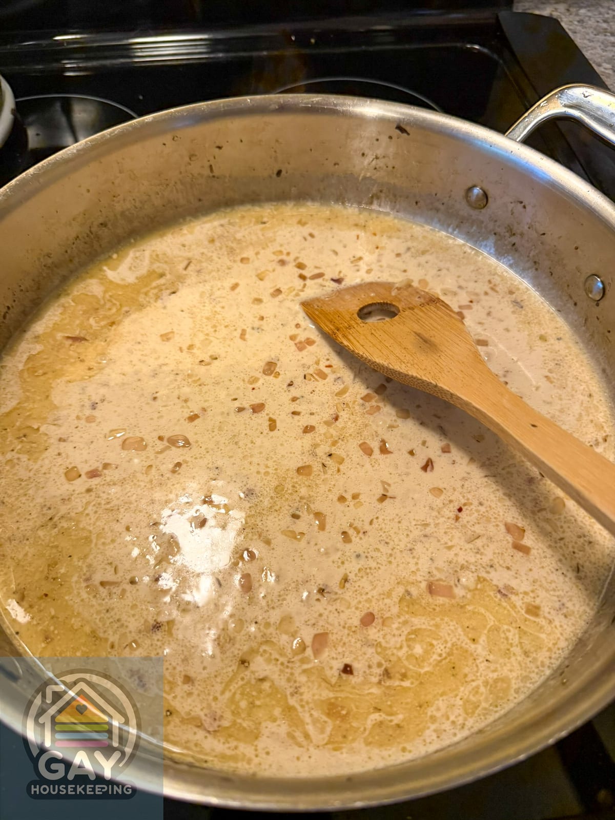 Cream and chicken stock simmering for Marsala pasta sauce